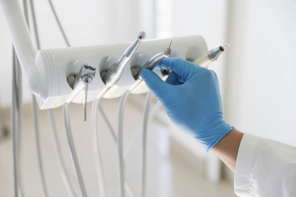 Professional Tooth Extraction technician working in Grand Rapids, MI